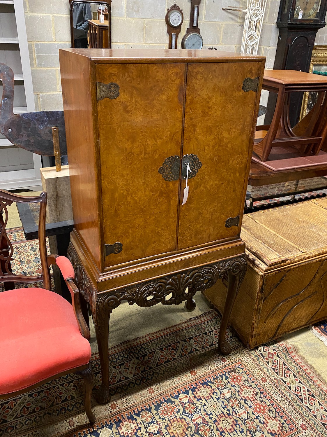 A Queen Anne style burr walnut cocktail cabinet, width 74cm, depth 46cm, height 145cm